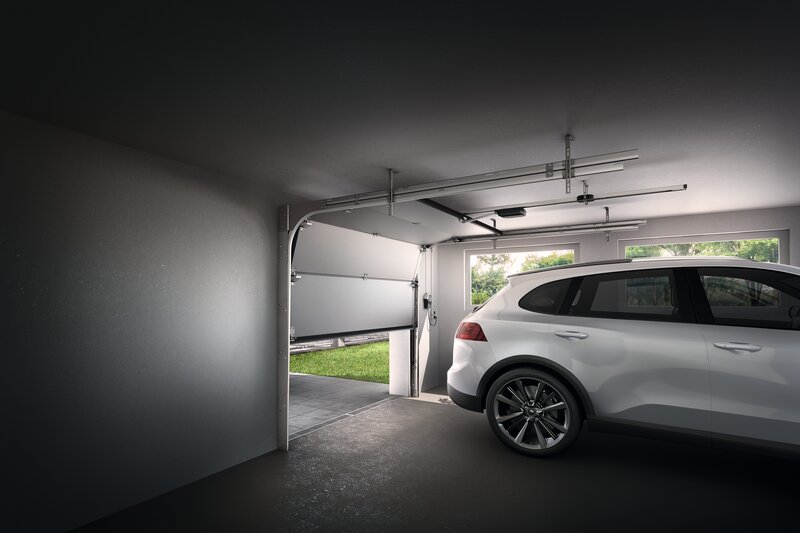 Sectional door with built-in operator